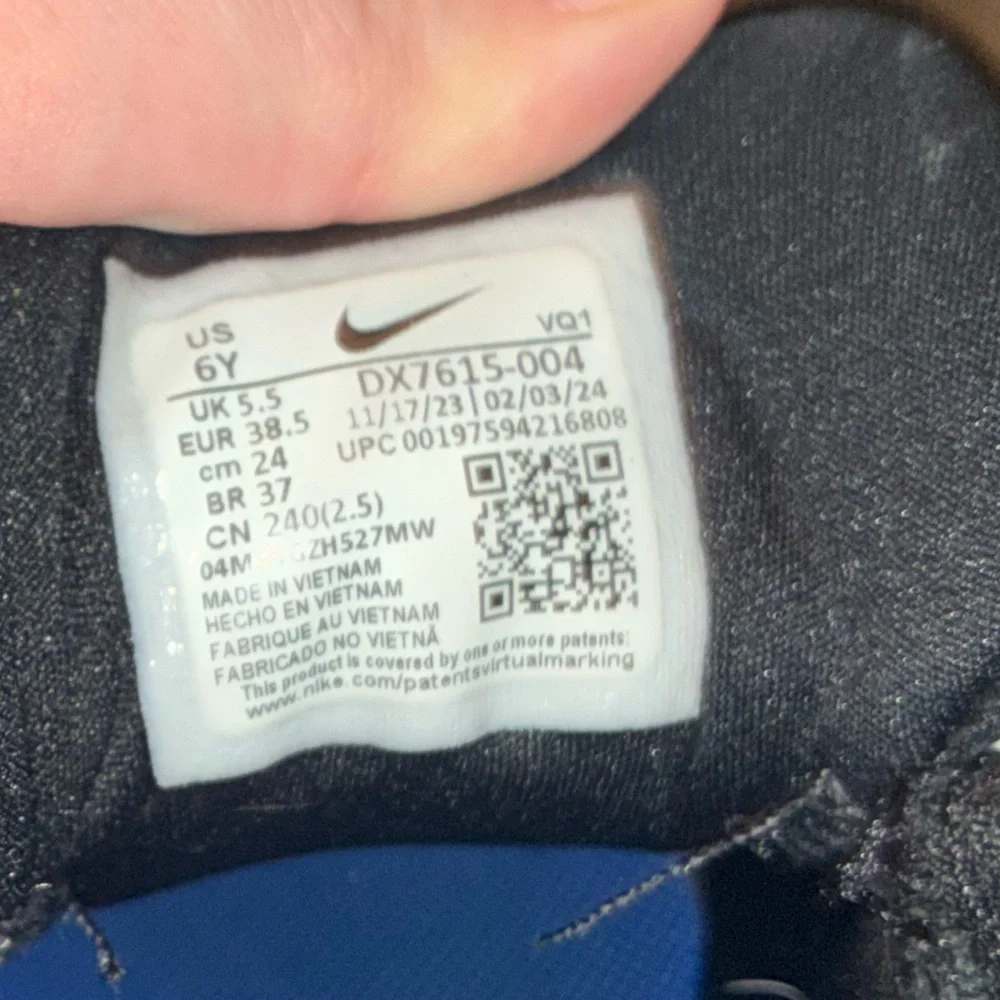Nike Kids Black Sneakers with Blue and Green Accents